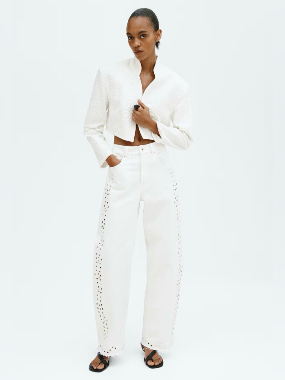 EYELET-EMBROIDERED JEANS